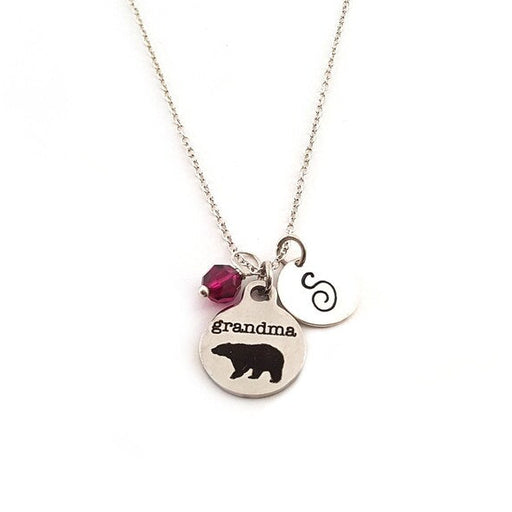 Necklace with pendant and red gemstone on a white background