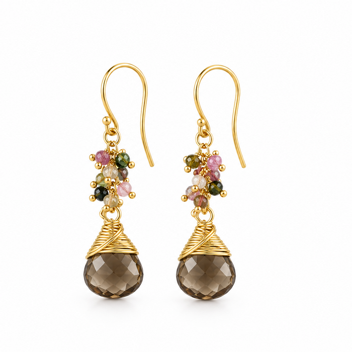 A pair of gold dangle earrings with faceted brown teardrop gemstones, small multicolored gemstone clusters, and textured gold wire wrapping, shown on a plain white background.