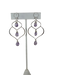 A pair of handcrafted silver and amethyst dangle earrings featuring a unique, organic wire frame design. Each earring has three faceted teardrop-shaped amethyst gemstones, wire-wrapped and suspended from delicate silver ear hooks. The background is a bright, clean white