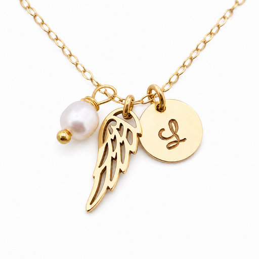Gold chain necklace with angel wing charm, round initial pendant engraved with 'L', and a white pearl bead charm on a white background.