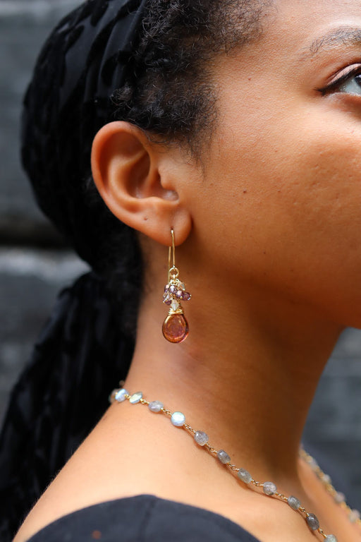 profile view of a model wearing jewelry