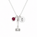 Necklace with a red bead, gavel charm, and round initial pendant on a white background
