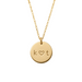 Gold necklace with a round pendant featuring 'k ❤️ t' on a beige background