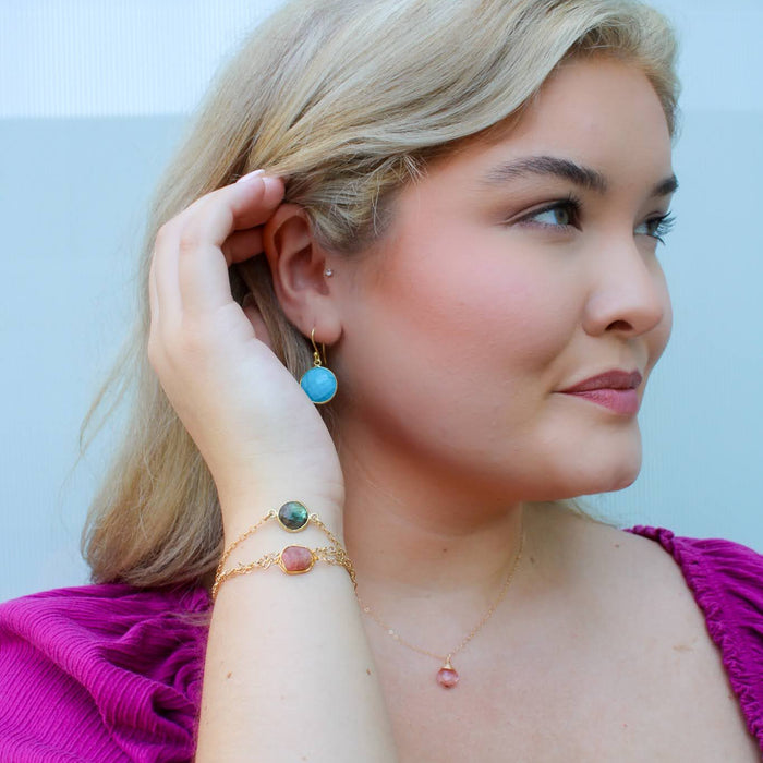 profile view of young lady wearing lots of jewelry