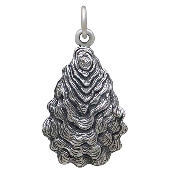 close up detailed view of a sterling silver oyster pendant