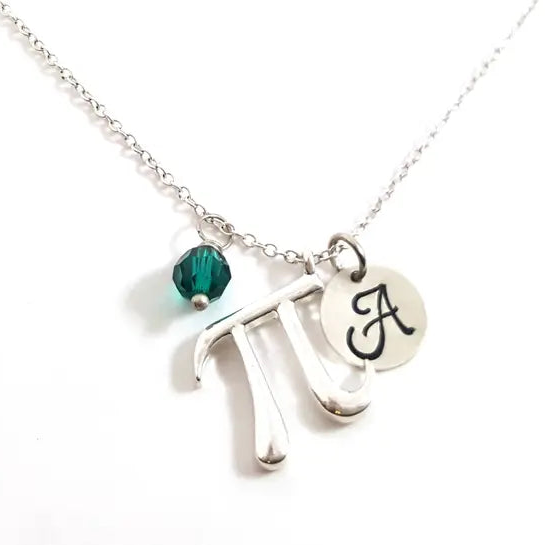 Necklace with a silver pi symbol and green bead on a white background