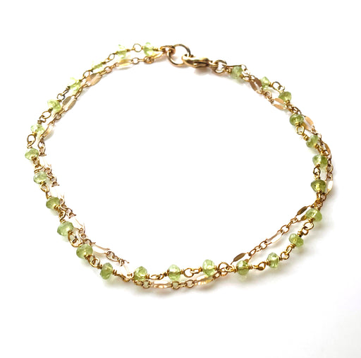 product photo of a peridot gemstone bracelet on a white background