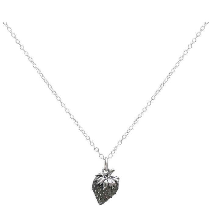 a silver strawberry charm hanging on a silver chain