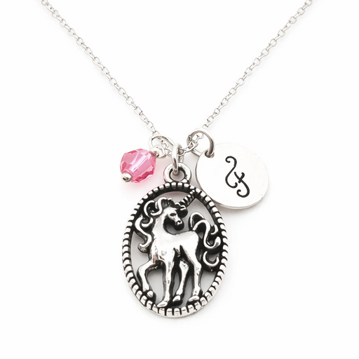 Necklace with unicorn pendant, pink bead, and silver tag on a white background